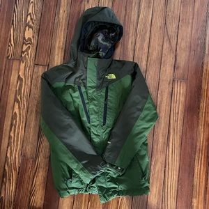 The North Face three in one ski jacket, hunter green with camo detail.